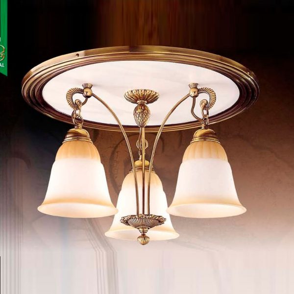 The Riperlamp Esparta Ceiling Light features a traditional design with three floral inspired amber glass lamp holders each supported by stem-like metal arms attached to a large, circular canopy in a bronze and white finish.