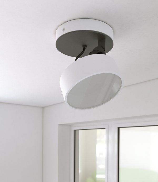 The Cleoni Dot Ceiling Spotlight is a surface fitted light with circular, adjustable lamp. Shows the spotlight turned off. White aluminium finish. Requires 10W LED light source (included).