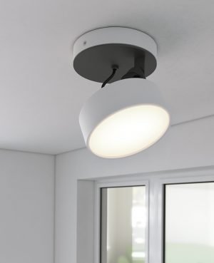 The Cleoni Dot Ceiling Spotlight is a surface fitted light with circular, adjustable lamp. Shows the spotlight turned on. White aluminium finish. Requires 10W LED light source (included).