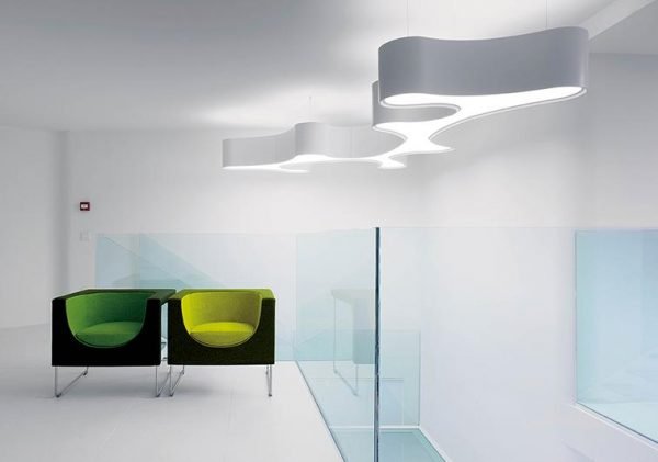 Vibia Ameba Pendant light suspended over a contemporary seating space.
